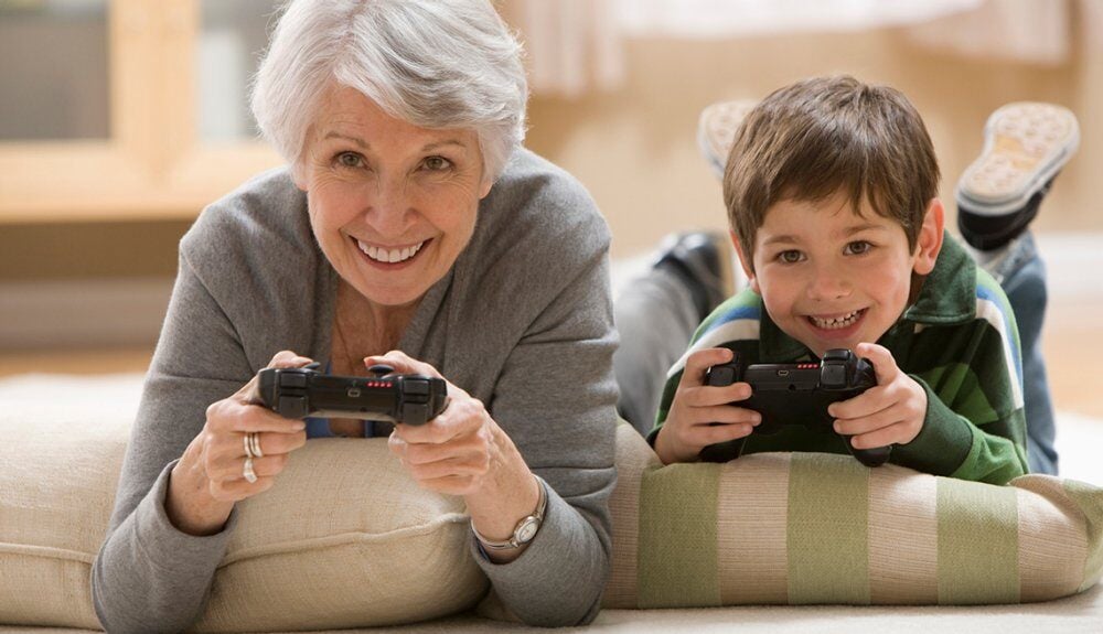 older-woman-playing-video-games-with-boy.imgcache.rev.web.1000.575